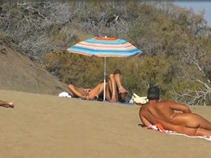 Slutwife masturbating for pervs in a beach