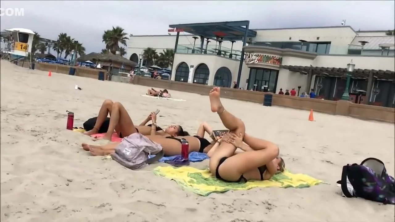 Fit blonde exercises on beach
