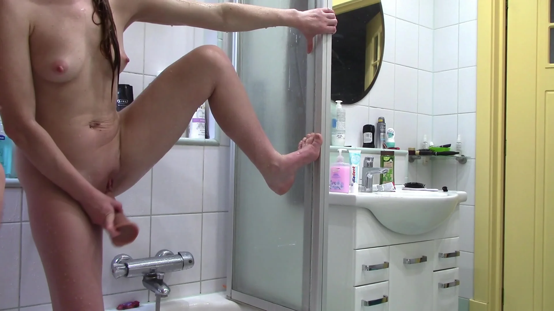 Wife Fucks Herself With A Big Dildo In Front Of The Shower Mirror And Masturbates